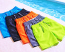 Kit 5 unidades Moda praia infantil masculina: shorts lisos em cores vivas para o verão no tecido tactel