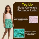 menina mostrando conjunto infantil no tecido canelado e linho