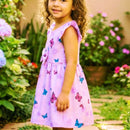 Vestido de festa infantil tema borboletas cor lilás com laço decorativo.