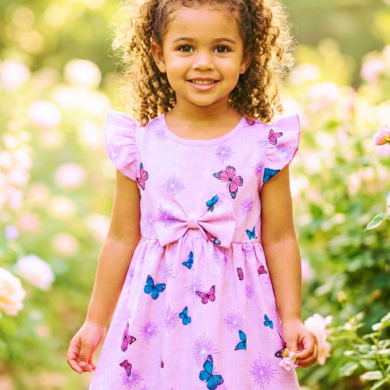 Frente de vestido para menina cor lavanda com um grande laço do mesmo tecido no peito